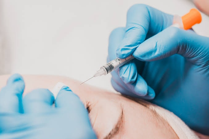 Close-up of aesthetic treatment injection on the face