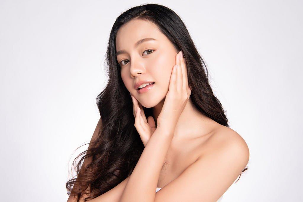 Woman with glowing skin after skin booster treatment